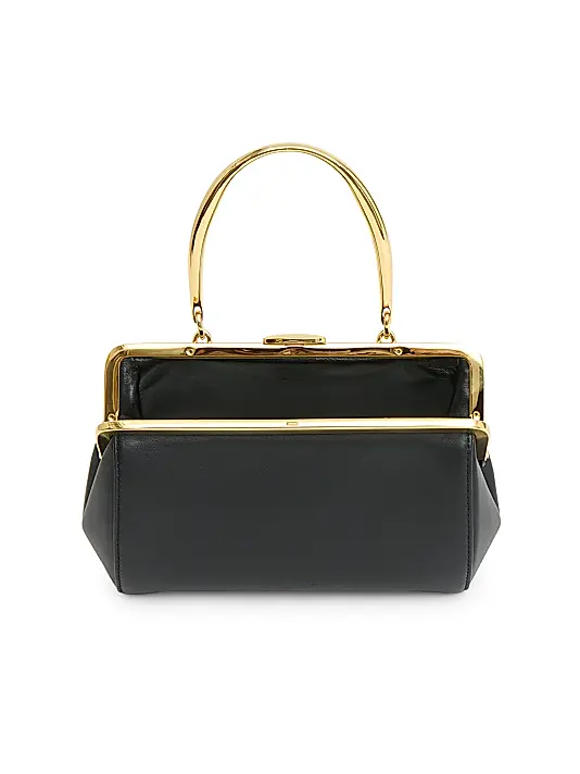 Formstabile Mini‑Handtasche mit goldener Rahmenverzierung, Druckknopf und Obergriff